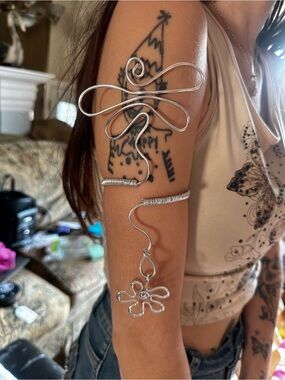 Handcrafted Silver-Tone Wire Arm Cuff with Flower Charm